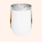 White tumbler with a clear lid on a light beige background